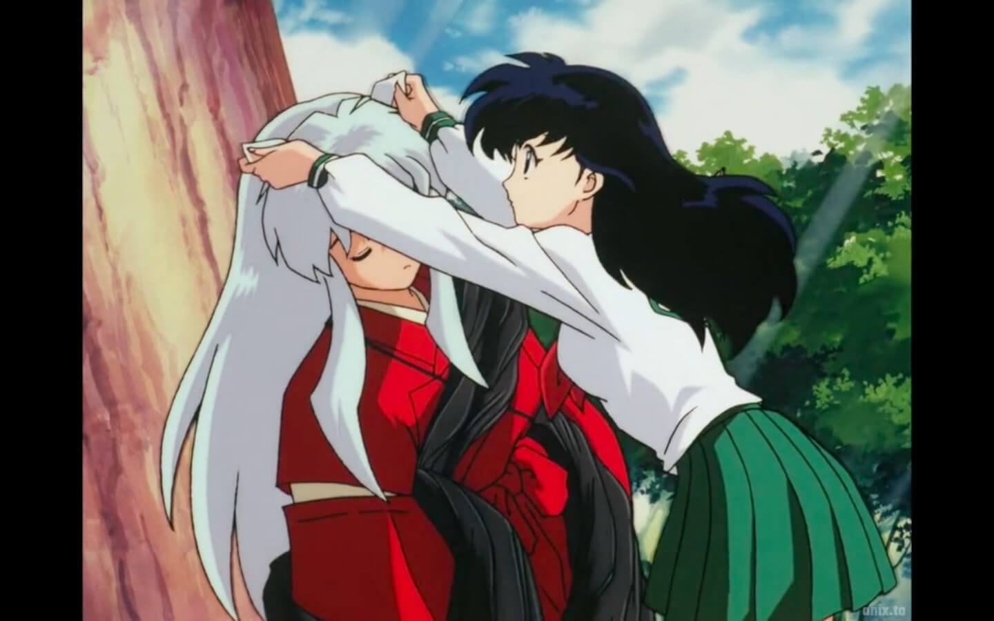 Kagome messing with Inuyasha's silly little dog ears while Inuyasha is trapped in his eternal slumber.