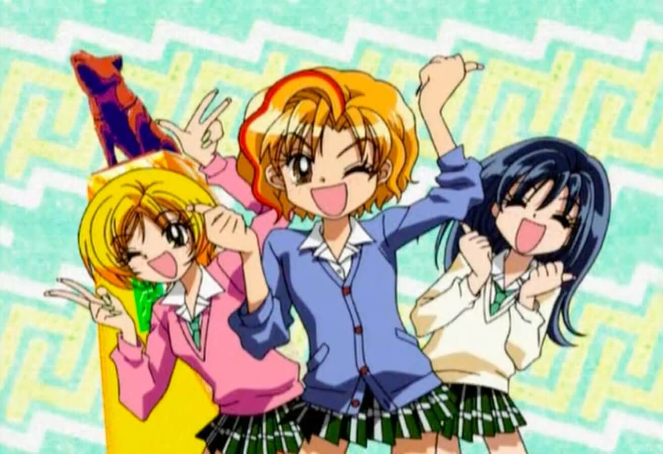 3 anime girls smiling happily at the camera. On the left is a blonde girl, Miyu, in the middle is a girl with orange hair and red streaks, Ran, and on the right is Ran's classmate with black hair who's name I forgot.