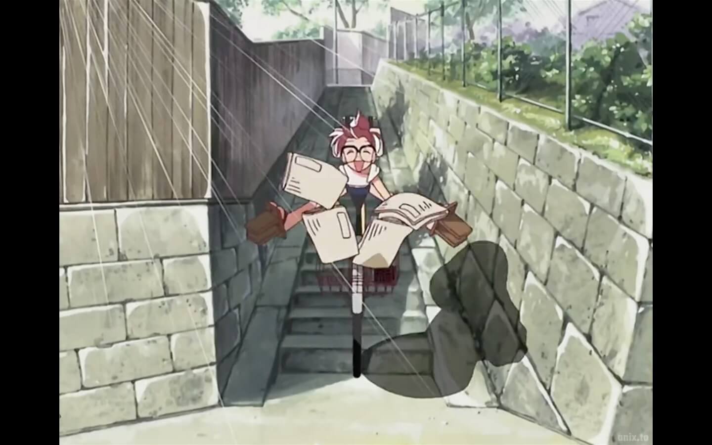 Marin happily riding a bike down a staircase.