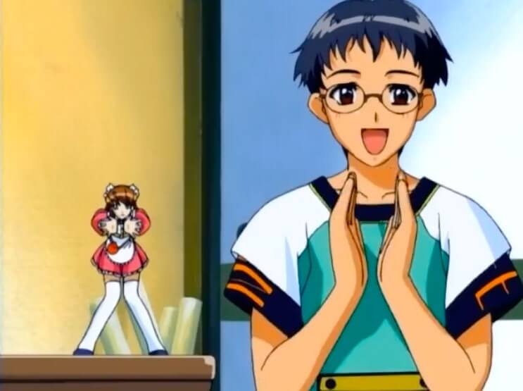 May and Saotome. May is standing on a table next to Saotome. She's small.