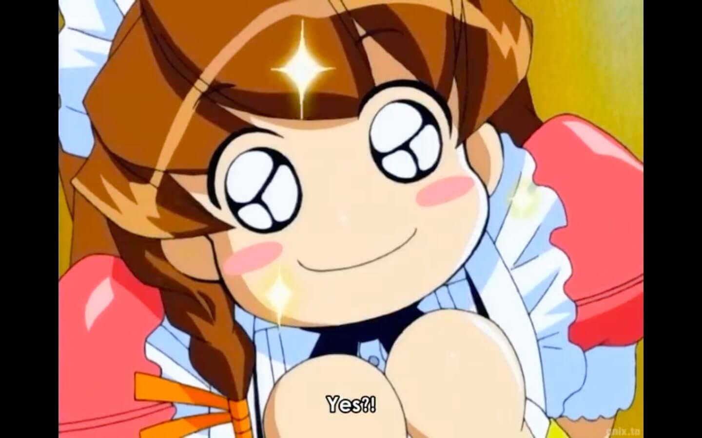 Chibi-style May looking up at the camera with big sparkling eyes. Subtitles read, Yes?! End subtitle.