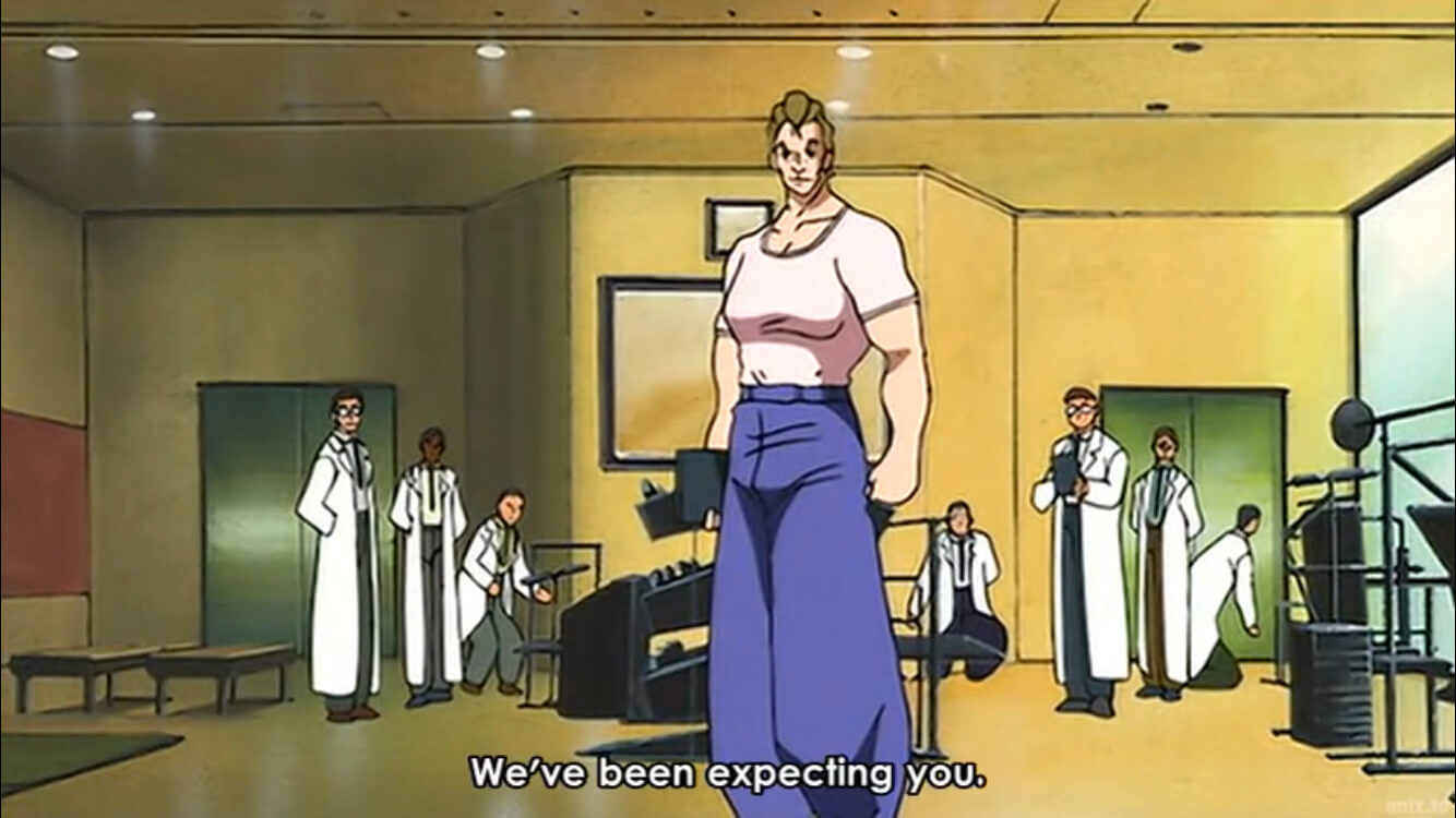 A personal trainer wearing a light pink shirt and blue bell-bottom jeans. He looks very buff, like an action figure toy. Subtitles read, We've been expecting you. End subtitle